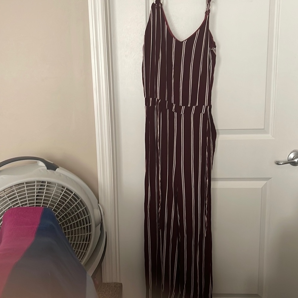 Burgundy jump suit.